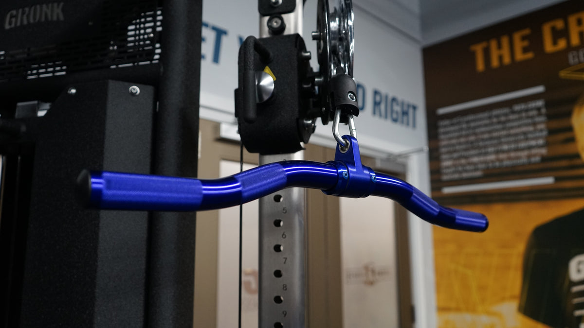 Gronk Fitness curl bar attached to cable machine