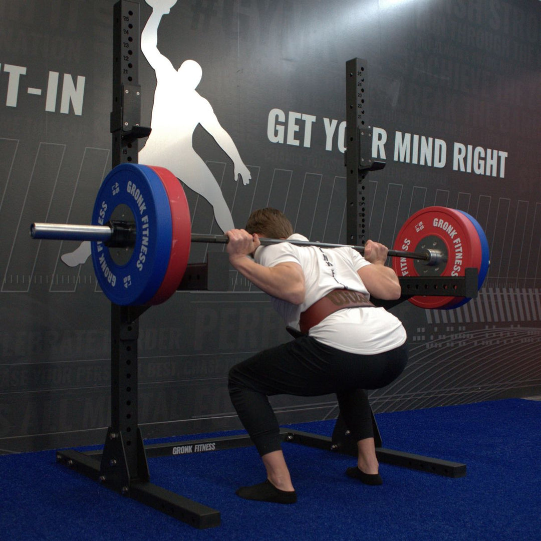 Gronk Fitness Squat Stand in use with red weights