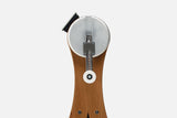 Close-up of the NOHRD WaterGrinder crank arm with handle positions on a cherry wood frame